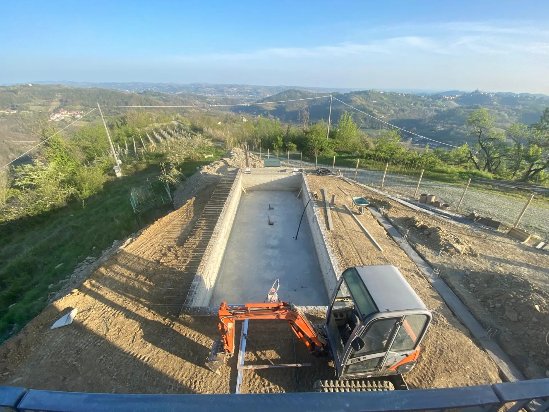 Cutting the access road into the hill